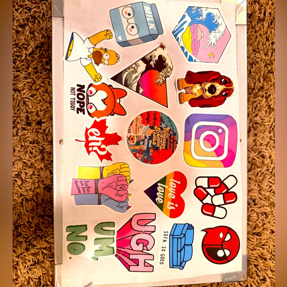Art case covered in stickers with art supplies inside